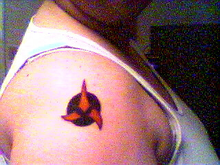 This is me with my tattoo that I got February 14, 1998.  It's the Crest for the Klingon Empire.